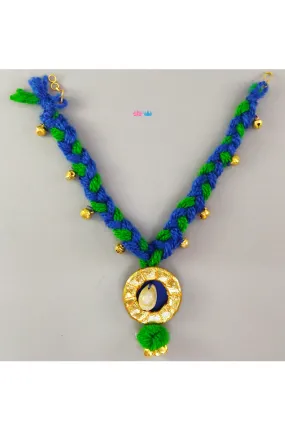 Braided blue and green ethnic pendant